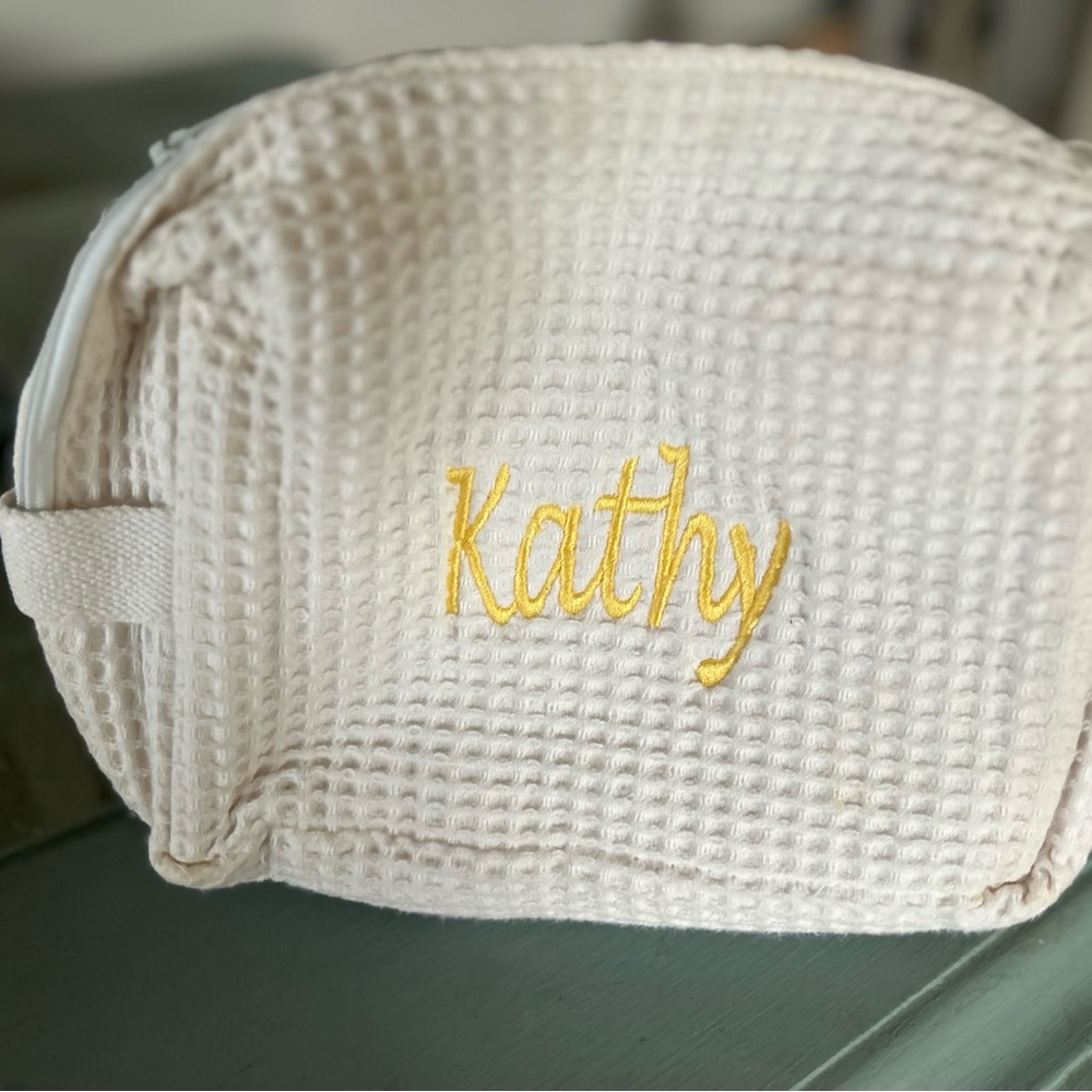 Cream Waffle Texture Pouch with Yellow Embroidery